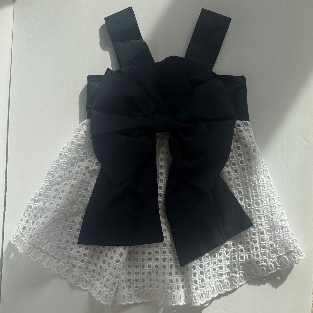 Designer navy bow dress and white eyelet